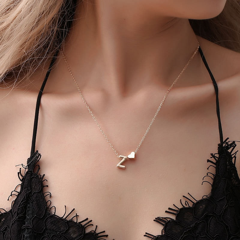 Necklace with an initial accompanied by a small heart